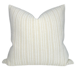 Divide Woven Pillow Cover in Ecru laying on a sofa with complementary neutral decor