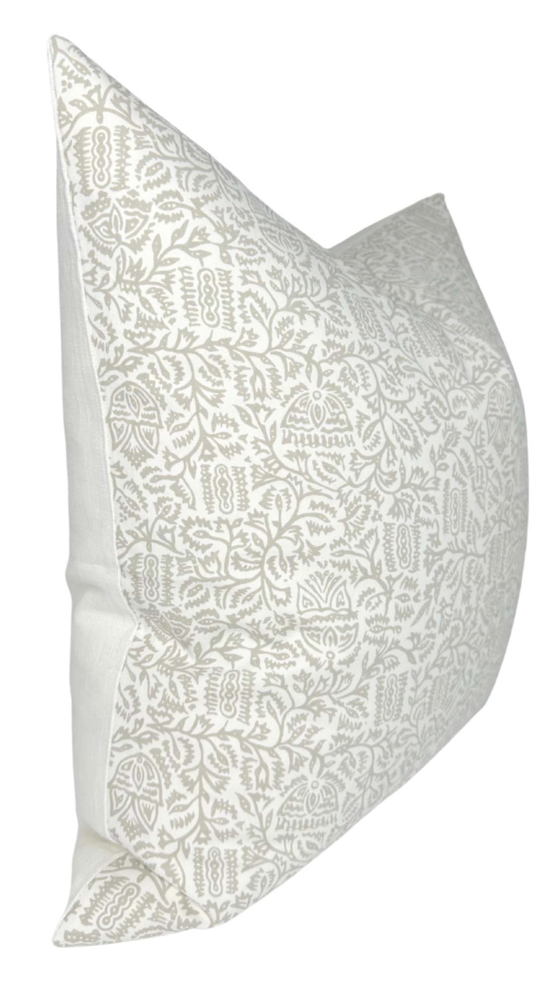 Soft taupe pillow cover featuring intricate Morris-inspired floral and geometric patterns on a creamy white background, shown from an angled side view.