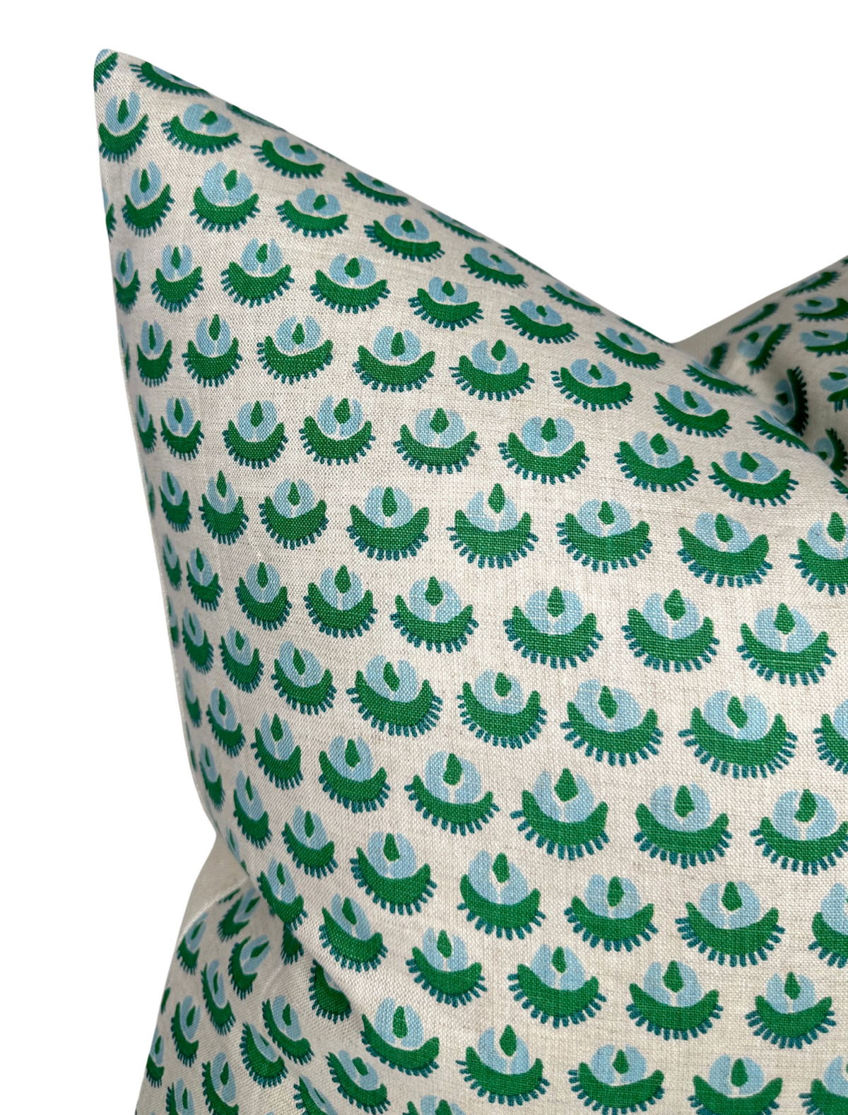 Close-up of a green Cadiz Pillow Cover with repeating abstract fan-like pattern on a white background by Walter G Textiles.