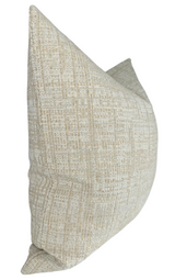 Sand-colored pillow cover with a textured, woven pattern in beige and light brown tones, shown from a side angle highlighting its plump shape.