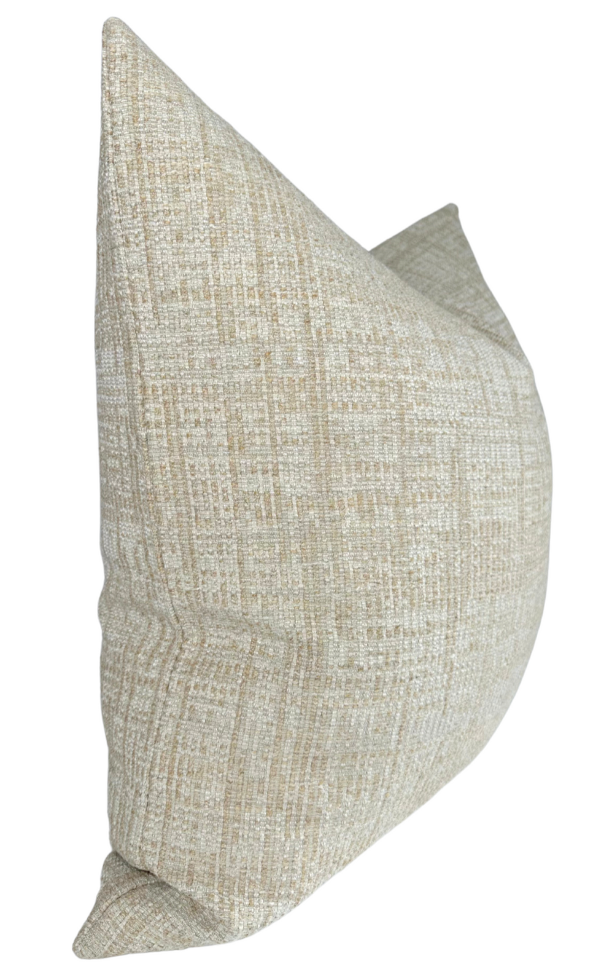Sand-colored pillow cover with a textured, woven pattern in beige and light brown tones, shown from a side angle highlighting its plump shape.
