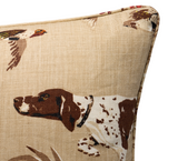 Brown pillow cover with a detailed print of a brown and white pointer dog and flying ducks on a textured beige background.