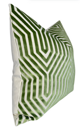 Square pillow with a lettuce green and white geometric maze-like pattern on the front and solid off-white fabric on the back and sides, angled view.