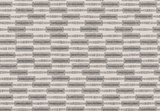 Rectangular blocks arranged in offset horizontal rows with coarse, shaded textures in charcoal gray on an off-white background, creating a woven brick pattern effect.