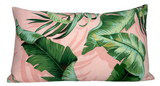 Rectangular pillow cover with pink background featuring large green palm and tropical leaves in varied shades and detailed veins.