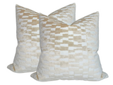 Pair of square tan brown velvet pillow covers with a subtle checkerboard pattern of alternating matte and shiny rectangular blocks.