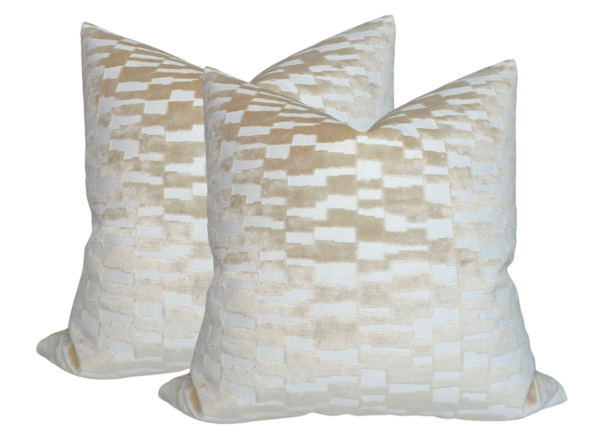 Pair of square tan brown velvet pillow covers with a subtle checkerboard pattern of alternating matte and shiny rectangular blocks.