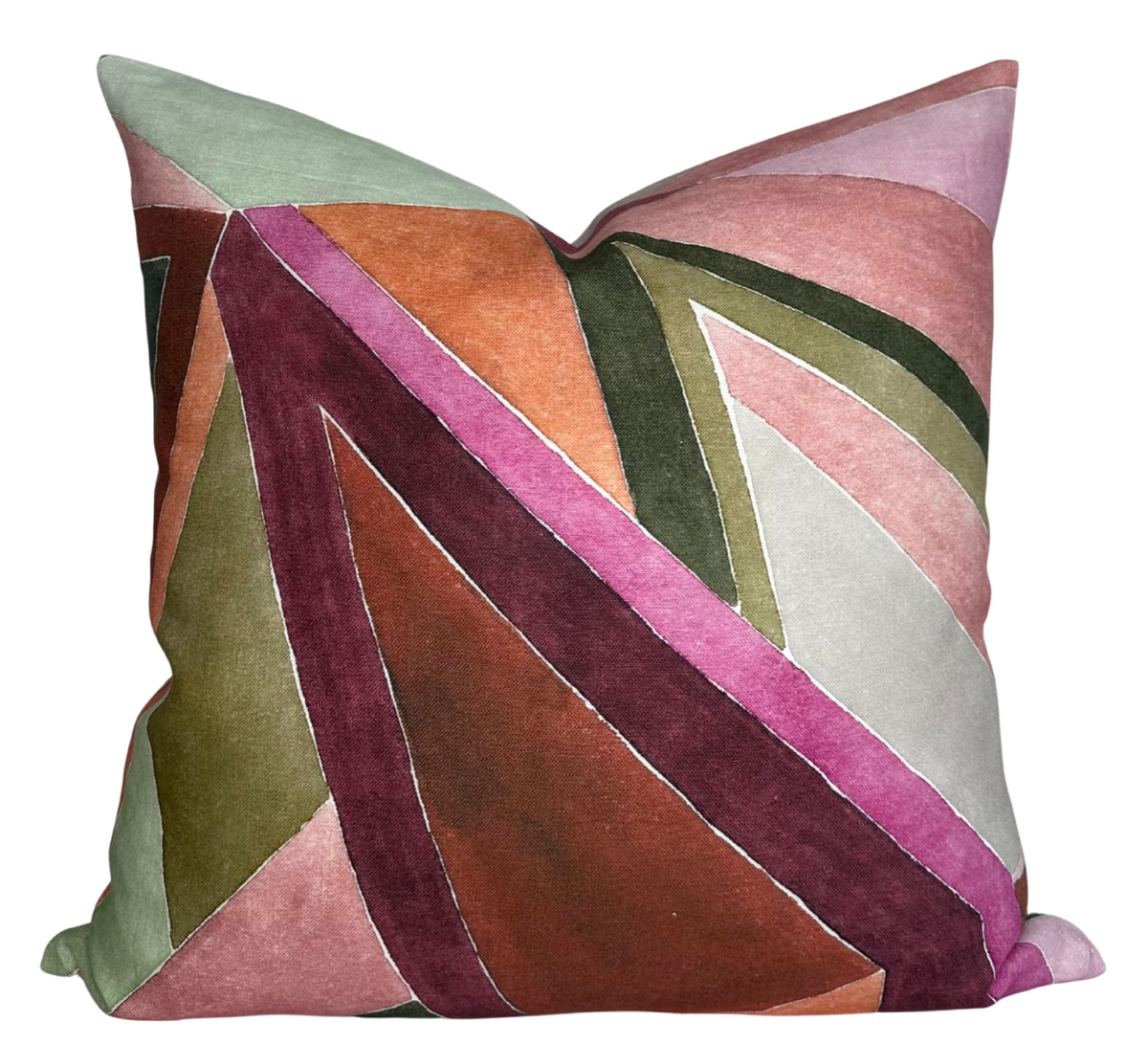 Square pillow with an abstract geometric pattern in muted rose, olive green, lavender, and burnt orange velvet sections with stitched borders.
