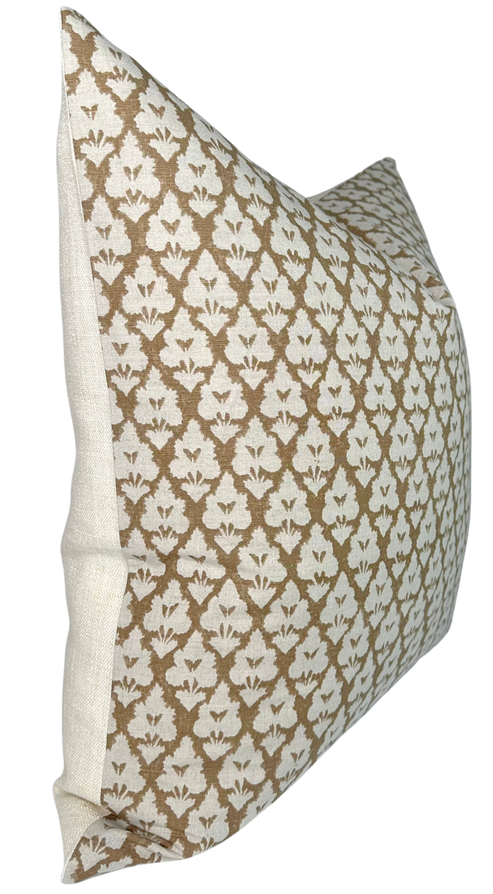 Rectangular pillow with a brown and white repeating floral damask pattern and plain light beige back panel, shown at an angled side view.