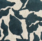 Close-up of Flores Pillow Cover fabric showing abstract navy blue and white organic shapes on textured linen background.