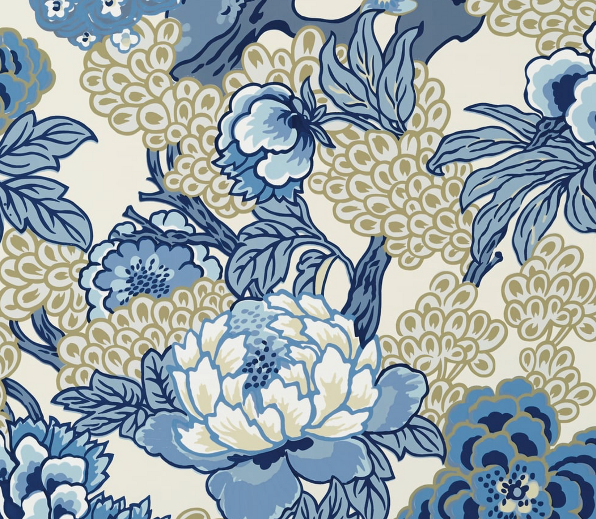 Floral pattern with large blue and beige blossoms and leaves on a cream background, featuring detailed petals and clustered round shapes.