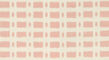 Close-up of a pink and cream Schumacher Townline pillow cover featuring a grid pattern of solid and abstract rectangular shapes with rough edges.