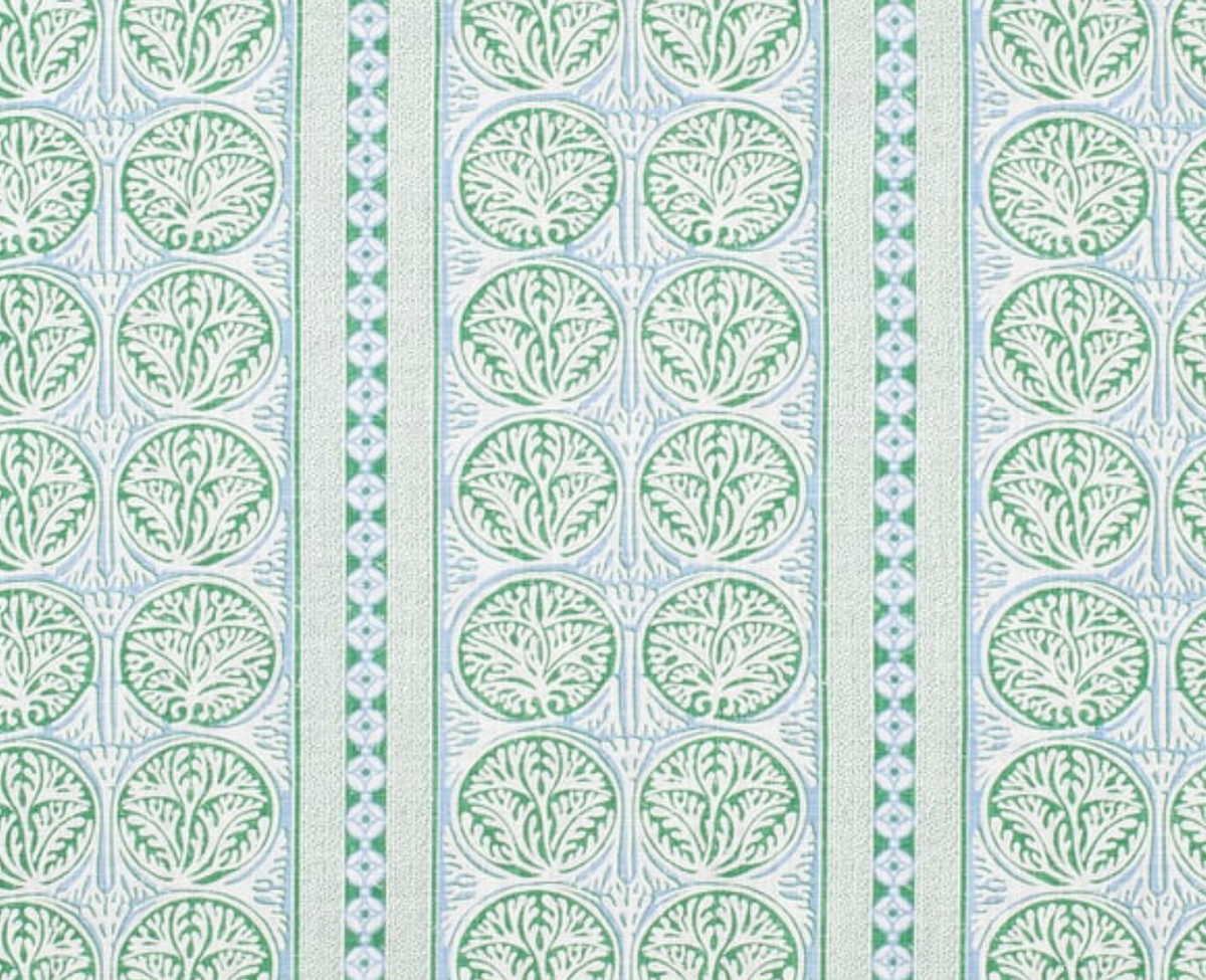Pattern of repeating circular motifs with green tree-like designs inside, separated by vertical blue and green striped bands on a white background.