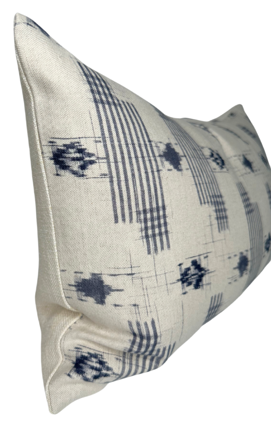 Rectangular pillow cover with a cream background featuring irregular blue grid lines and abstract blue inkblot patterns in a repeating horizontal design.