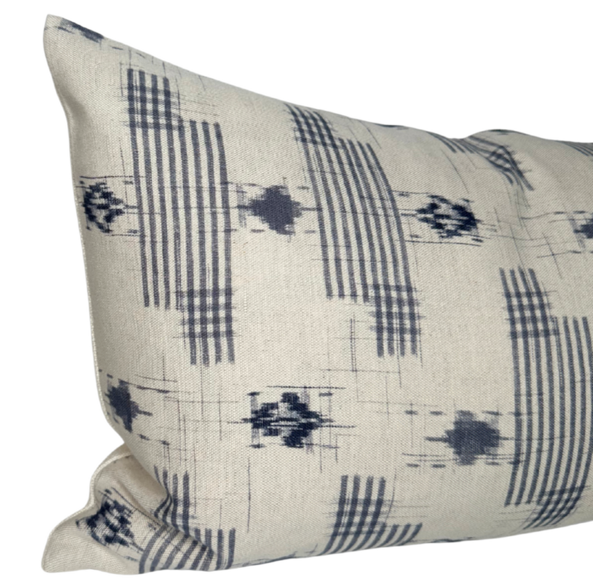 Rectangular pillow cover with a beige background and abstract blue geometric patterns resembling vertical stripes and scattered pixel-like shapes.