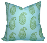 Square pillow with sky blue fabric featuring a repeating pattern of green paisley floral motifs and decorative vertical borders on the side edges.