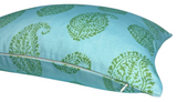 Rectangular pillow with blue fabric featuring a repeating green paisley floral pattern and a visible zipper along one edge.