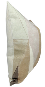 Side view of a geometric-patterned pillow cover with muted shades of beige, cream, and pale brown arranged in angular sections creating a subtle patchwork effect.