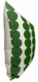 Pillow cover featuring green circular patterns arranged in vertical rows on a white fabric background, with a plain beige back panel.