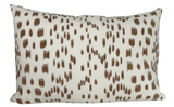 Rectangular pillow cover with irregular tan brown brushstroke pattern on an off-white background, creating a textured spotted effect.