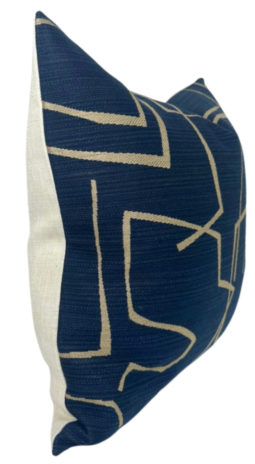 Rectangular pillow cover with deep indigo front featuring beige abstract linear patterns and a plain off-white fabric on the sides and back.