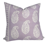 Square lilac purple pillow cover featuring white paisley patterns with delicate floral details and a coordinating border strip along one edge.