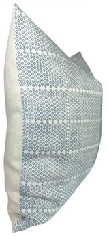 Rectangular pillow cover featuring horizontal rows of small blue geometric patterns on a light background, with plain light fabric on the sides.