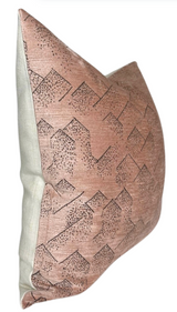 Square pillow with rose-colored front featuring geometric mountain-like patterns in black dots and lines, and solid light gray back fabric.