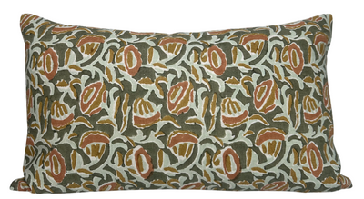 Marbella Pillow Cover with green printed front and ivory linen back displayed on a bed