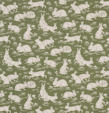 Pattern of white cottontail rabbits in various poses on a sage green background with small grass tufts, creating a whimsical natural scene.