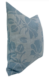 Square pillow with a muted blue floral pattern on a lighter blue textured fabric, shown at a slight angle highlighting its plush, soft shape.