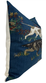 Navy blue pillow cover with side view showing a hunting dog and floral design in earth tones, featuring a cream-colored back panel.
