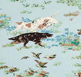 Three hunting dogs—white with brown patches, solid white, and black with brown—running among blue and green grass with small birds flying nearby on a light blue background.