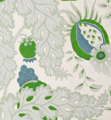White fabric with large green and blue botanical motifs featuring leaves, berries, and stylized seed pods in a delicate, flowing pattern.