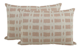 Two rectangular pillows with a pink grid pattern of short horizontal and vertical brushstroke lines on an off-white fabric background, shown side by side.