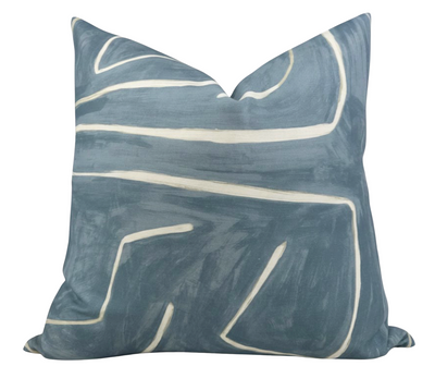 Graffito Pillow Cover in Deep Sky with abstract blue and white linen fabric alongside ivory linen backing