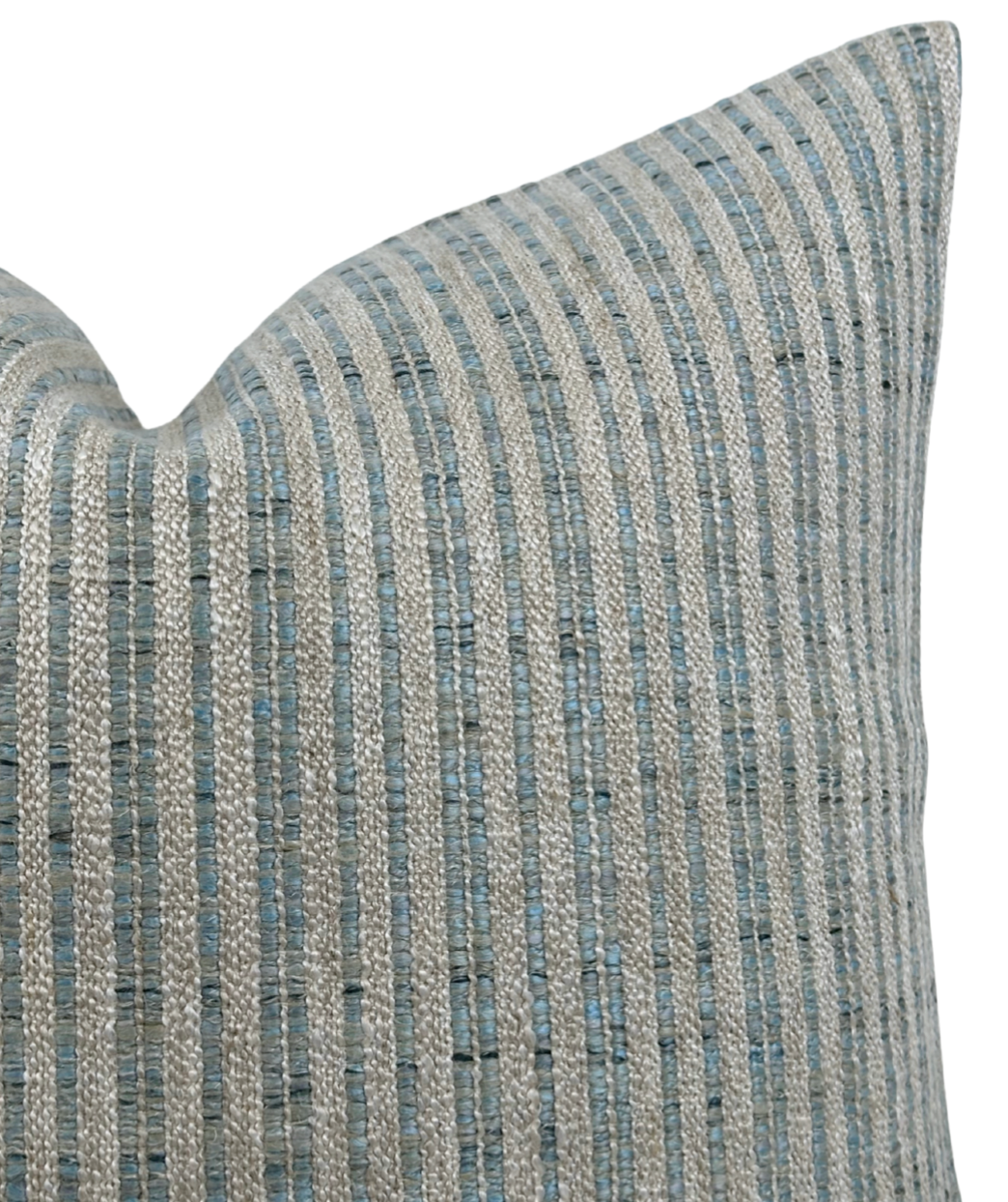 Close-up of an aqua blue and silver striped woven pillow cover with a textured pattern and a pointed corner.