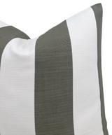 Close-up of a pillow cover featuring wide vertical stripes in olive green and white with a finely textured fabric weave.
