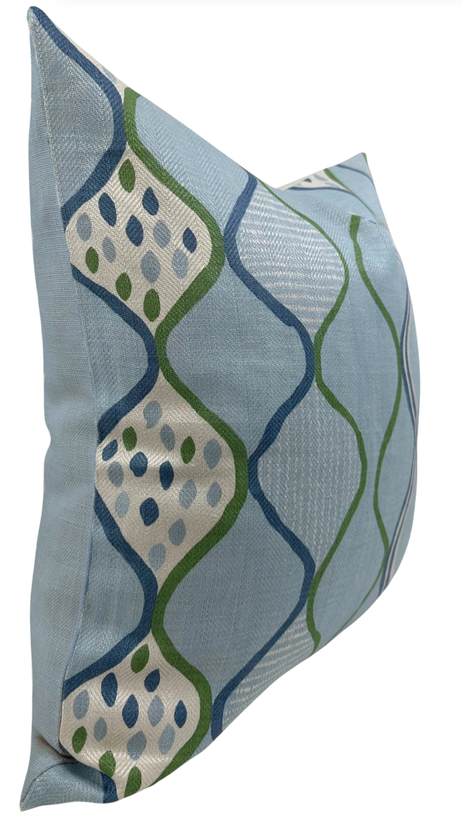 Rectangular pillow cover in pale blue fabric with a woven geometric pattern of curved blue and green lines enclosing dotted white diamond shapes.
