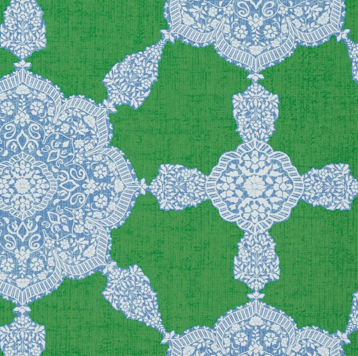 Intricate blue and white medallion patterns on a textured green background, forming a symmetrical design with floral and ornamental details.