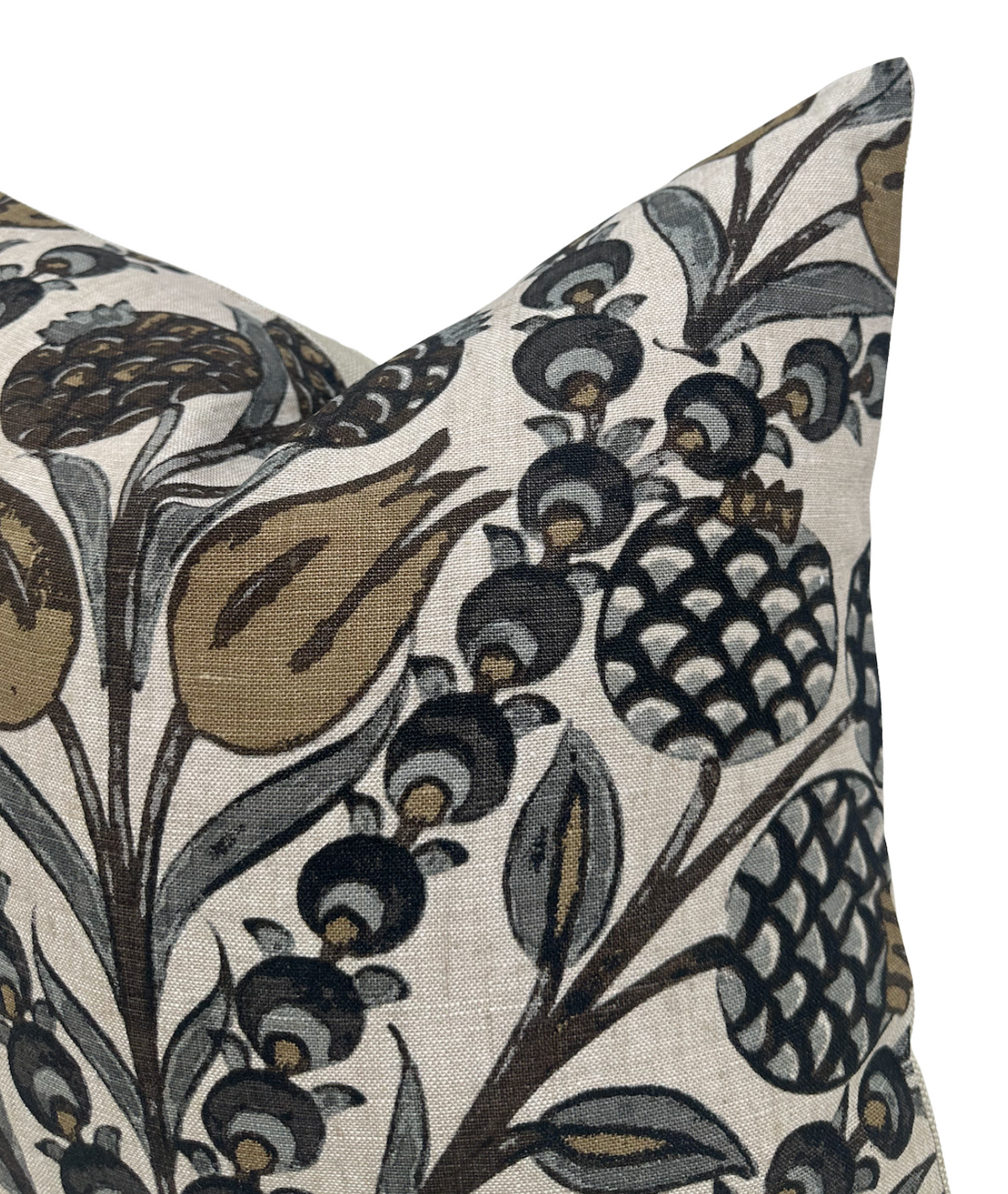 Corner of a beige pillow cover with a detailed floral and botanical pattern in grey and gold tones featuring stylized bulbs and berries.