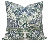 Shangri La Pillow Cover in Verde Green with abstract pattern, shown on sofa with coordinating cushions