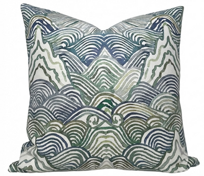 Shangri La Pillow Cover in Verde Green with abstract pattern, shown on sofa with coordinating cushions