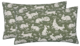 Rectangular pillow covers in sage green with a repeating pattern of white cottontail rabbits in various poses scattered across the fabric.