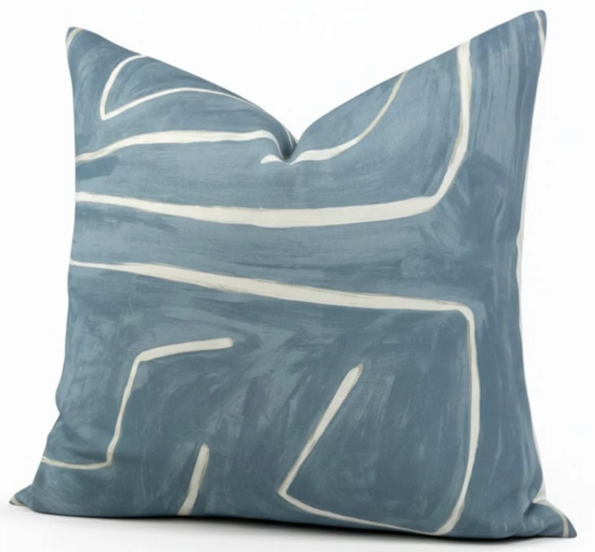 Square pillow cover in muted sky blue with an abstract white linear pattern resembling brush strokes across the fabric.