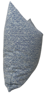 Square pillow cover with intricate indigo blue diamond and floral pattern on white background, showing textured woven fabric and side seam detail.