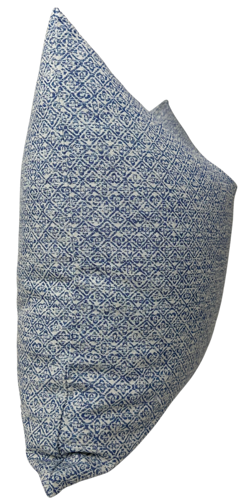 Square pillow cover with intricate indigo blue diamond and floral pattern on white background, showing textured woven fabric and side seam detail.