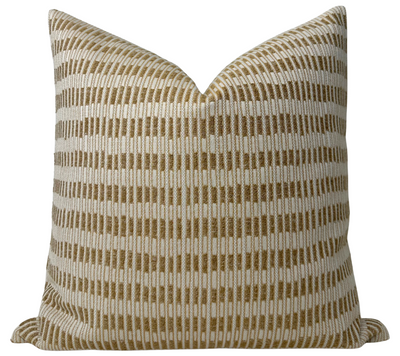 Baja Pillow Cover in Coin, showing the woven front fabric and ivory linen back.