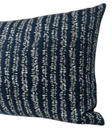 Rectangular pillow cover featuring a woven textured pattern of irregular vertical white stripes on an Atlantic blue background.