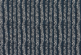 Close-up of a woven textile in deep Atlantic blue featuring vertical white dash patterns arranged in irregular, wavy stripes creating subtle texture.